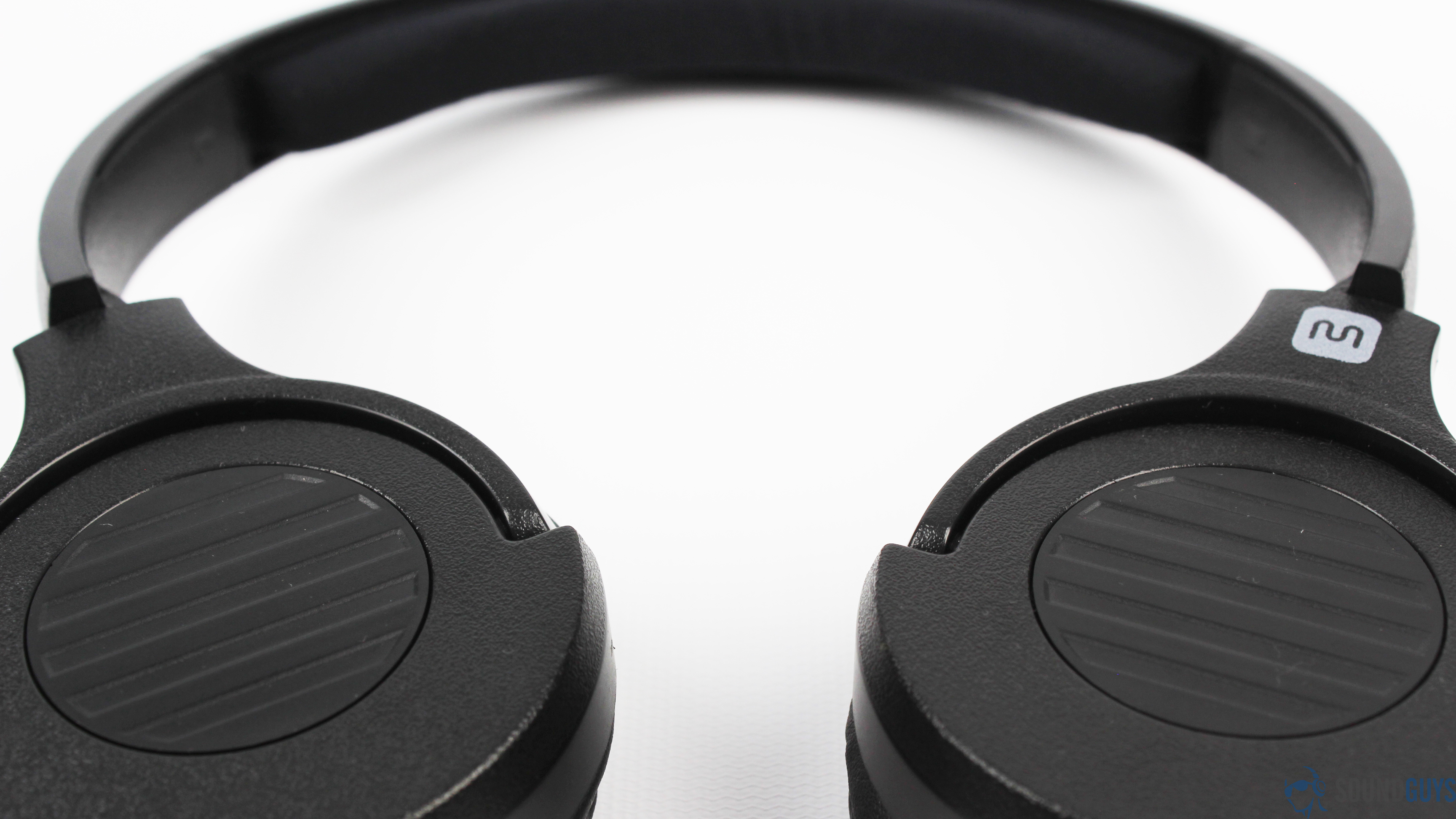 The Monoprice Hi-Fi On-Ear headphones in black against a white table.