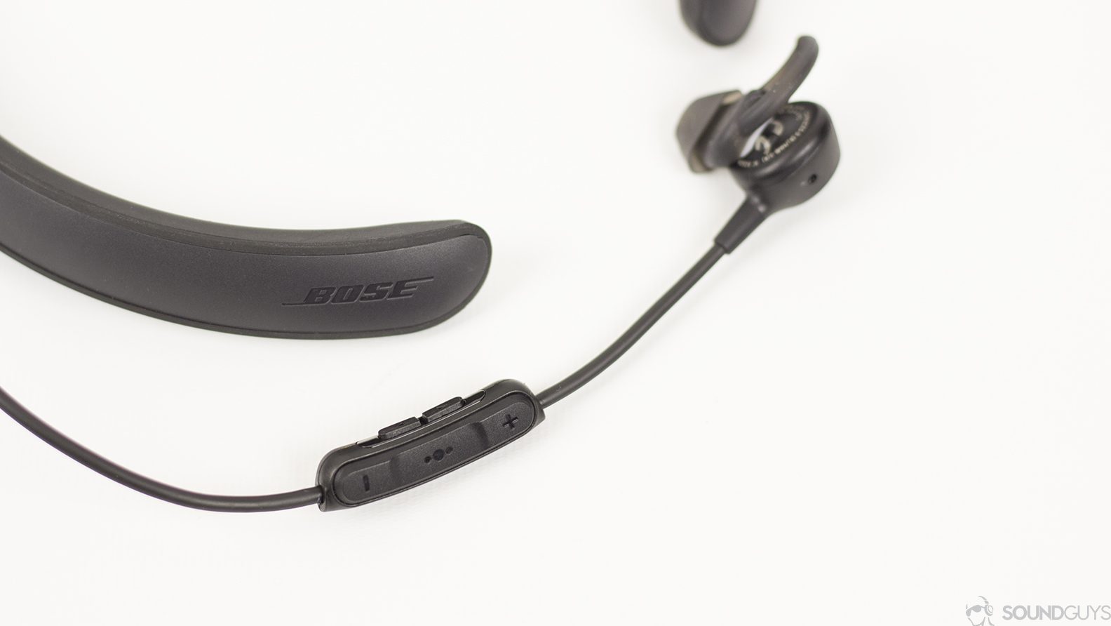 Noise canceling earbuds Bose QC 30 on white background.