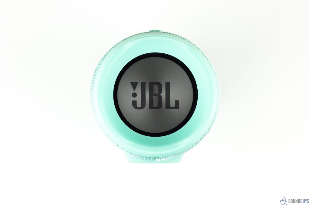 Pictured is the teal JBL Charge 3 Bluetooth speaker with the JBL logo on the passive radiator facing up on a white background.