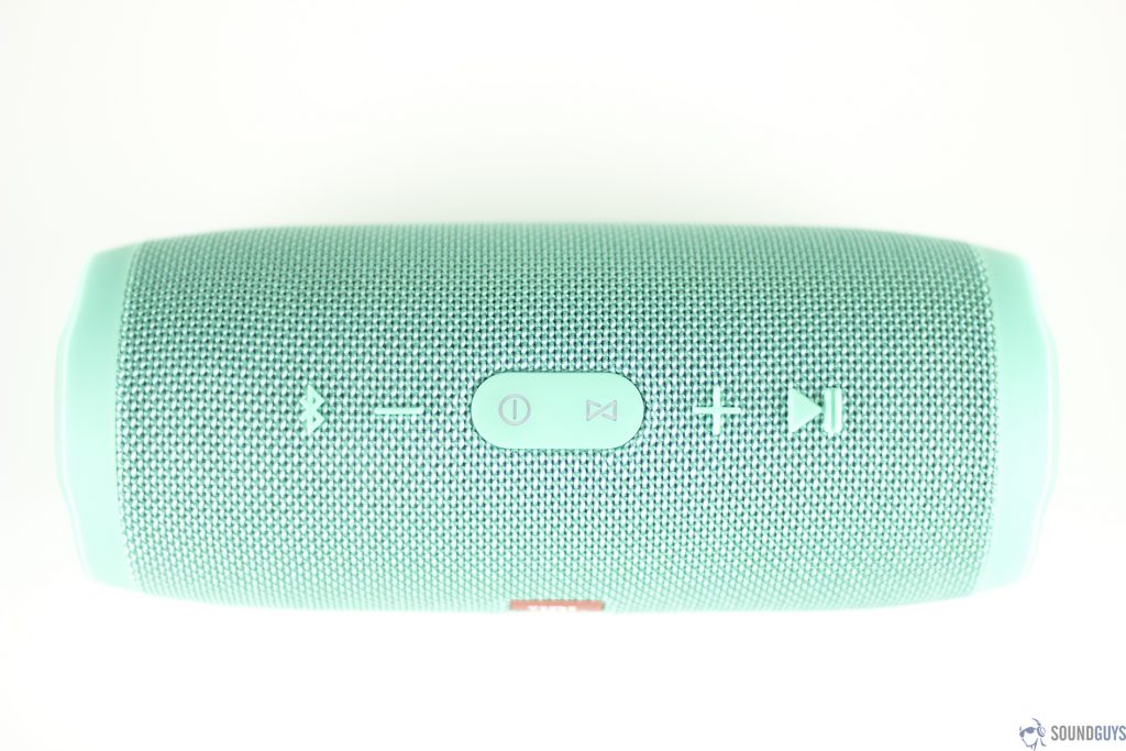 Pictured are the playback buttons of the teal version of the JBL Charge 3.