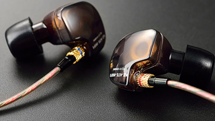 Best earbuds under $20: The KZ ATE HiFi 'buds on a black background. The earbuds are a copper/brown color.
