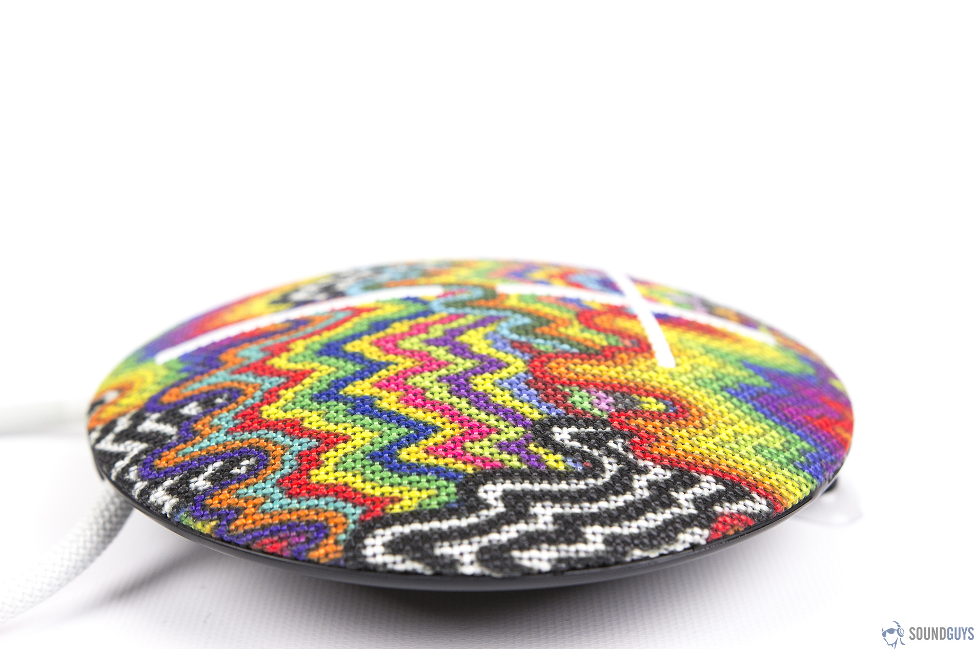 A lateral, straight-on view of a rainbow-patterned UE Roll 2 on a white background.