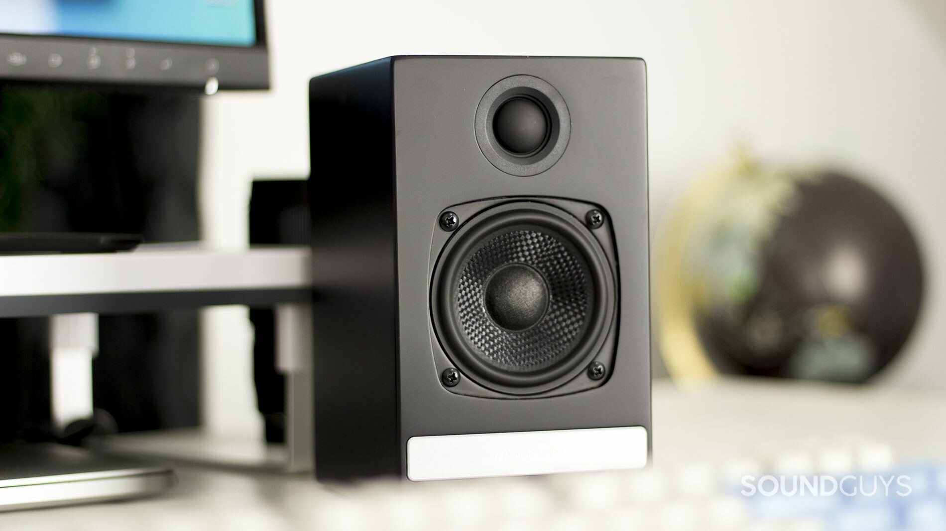 The Audioengine HD3 bookshelf computer speaker in black on a desktop.