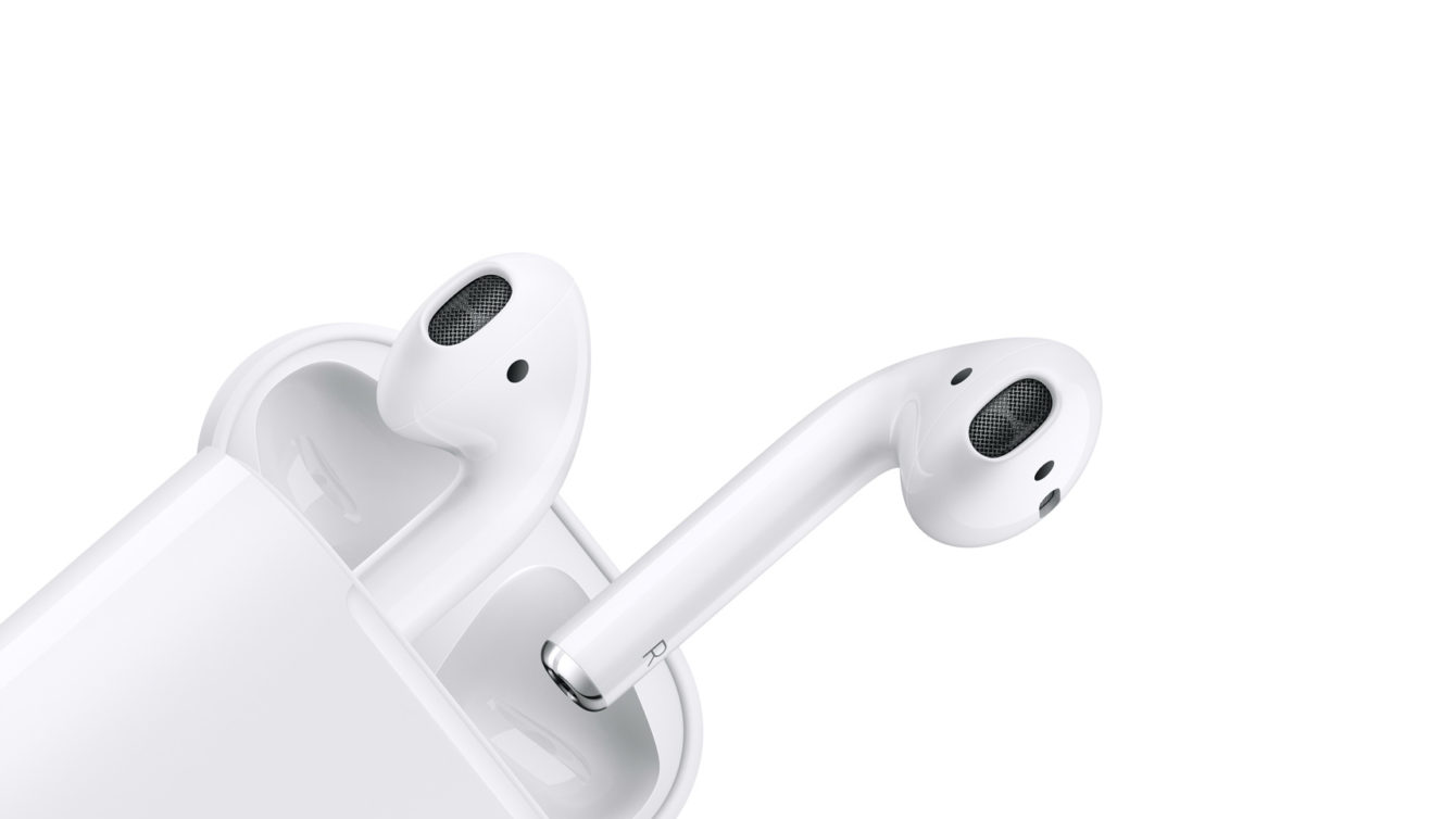 Product image of the Apple AirPods against a white background. The earbuds are being removed from the case.
