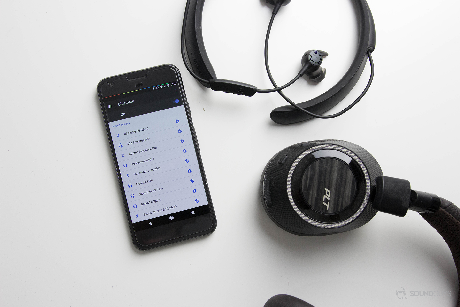 A picture containing wireless headphones, wireless earbuds and a phone