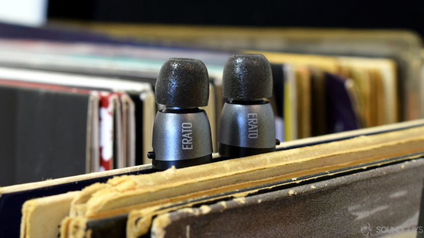 AAC and aptX codecs are supported by the ERato Apollo 7 truly wireless earbuds. Pictured: The Erato Apollo 7 earbuds resting on a stack of vinyl LPs.