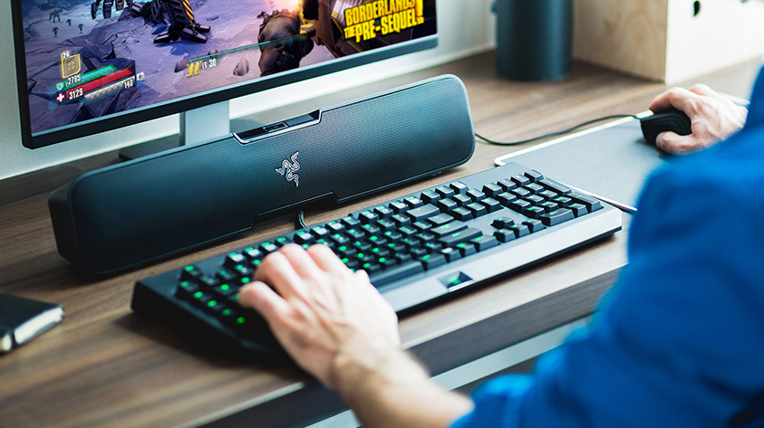 A photo of the Razer Leviathan soundbar in use at a computer