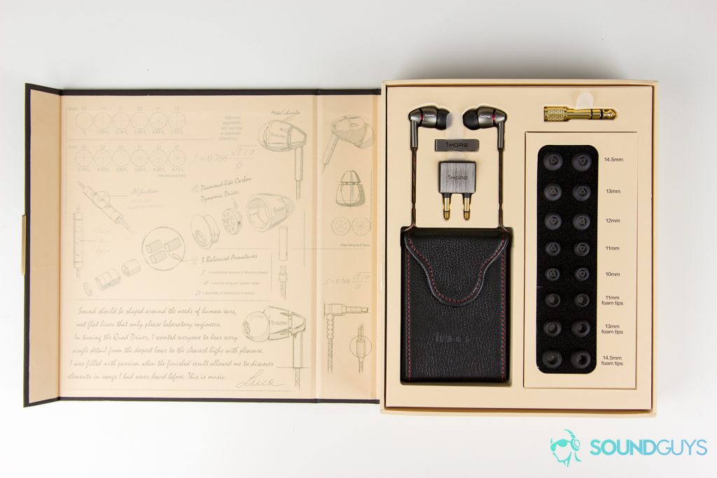 The packaging open to reveal inclusions of the 1MORE Quad Driver In-Ear earphones.