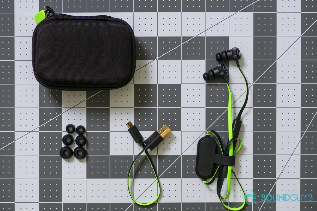 A photo of the tips, USB cable, carrying case, and earbuds.