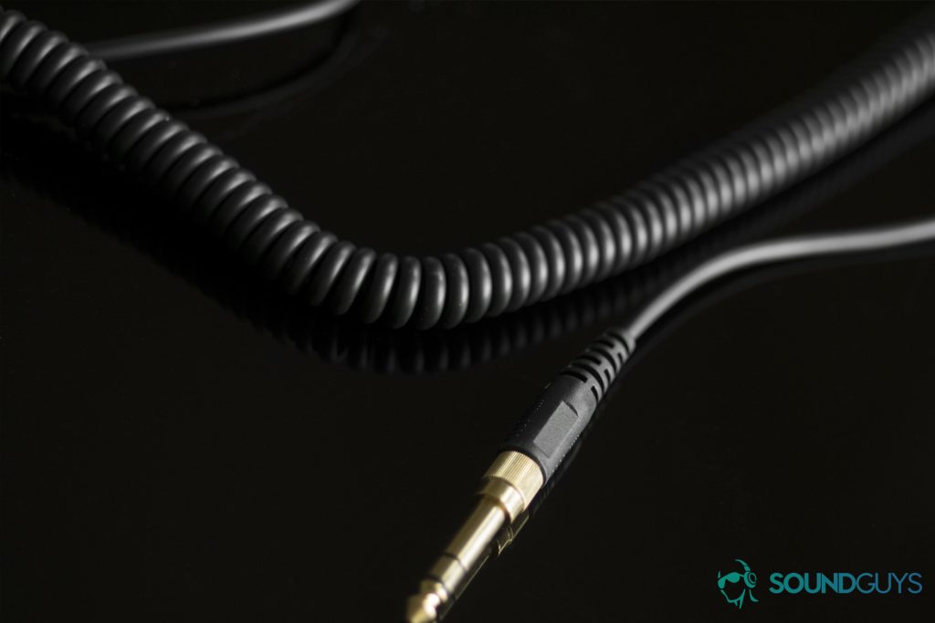 A photo of a coiled headphone cable with 1/4" TRS termination.