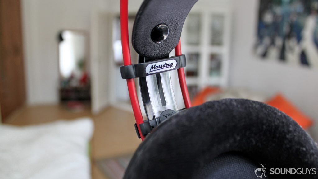 A close-up photo of the Massdrop logo on the AKG K7XX.