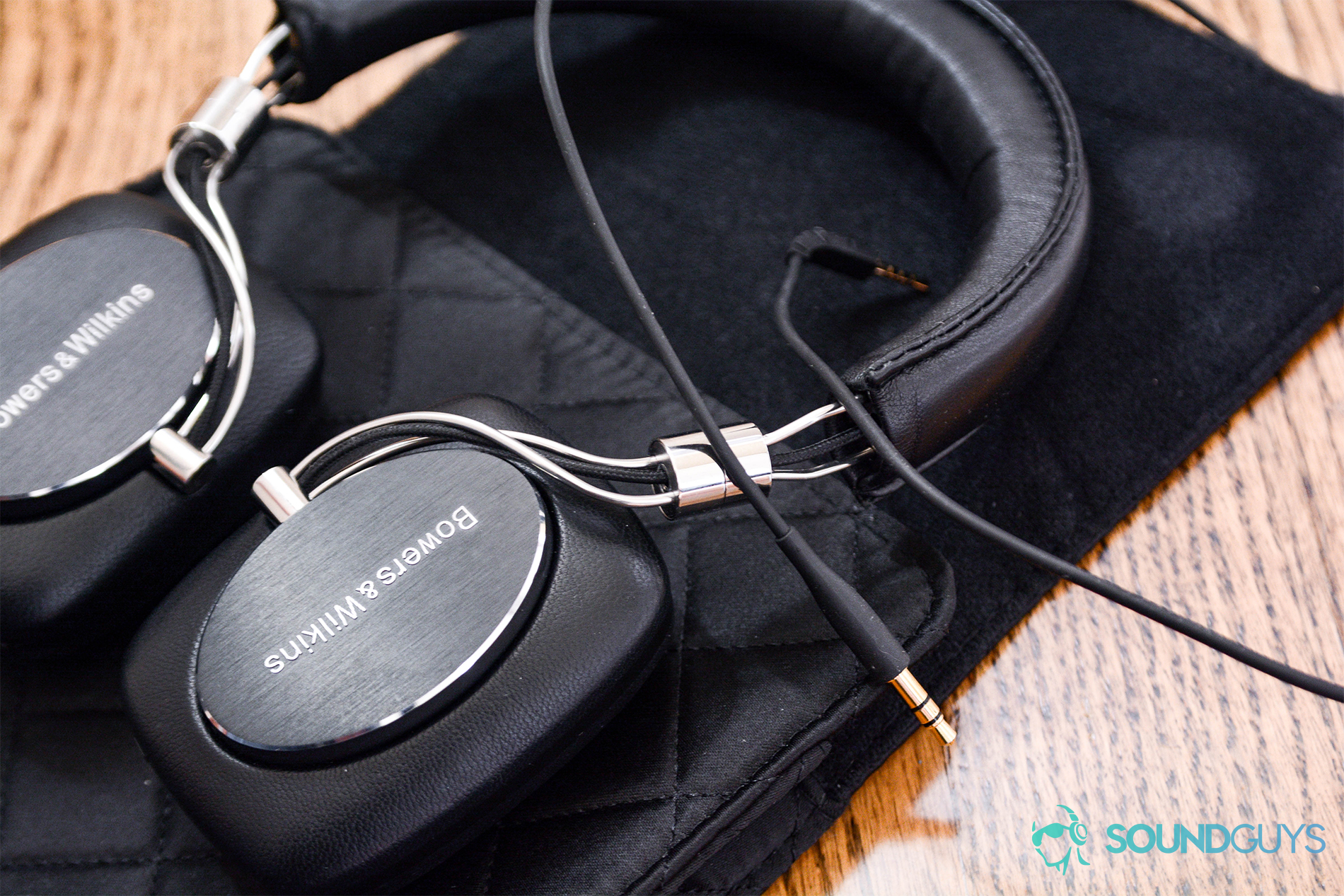 Bowers and Wilkins P5 Wireless: The headphones on the quilted carrying case with the proprietary cable.
