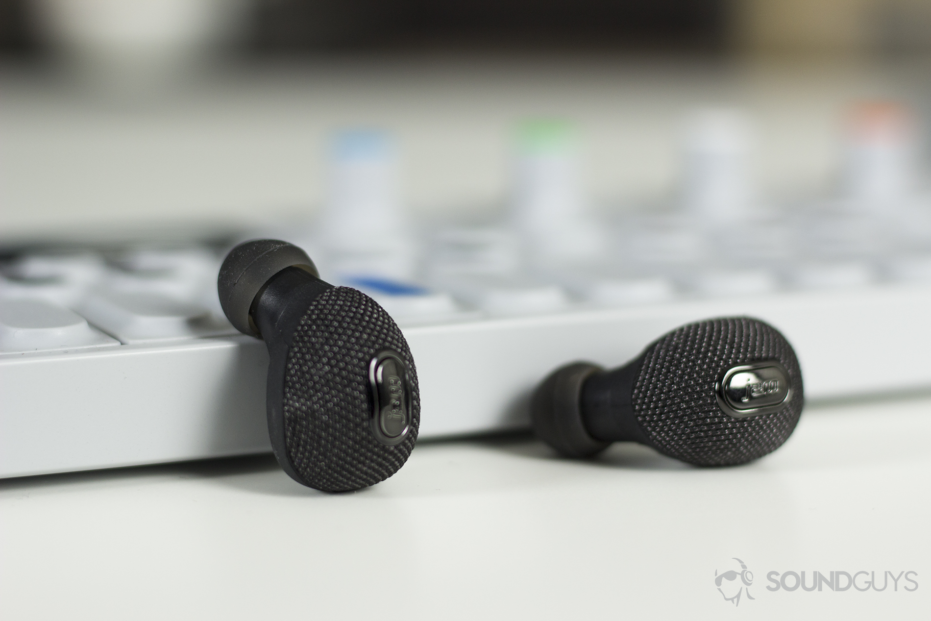 The Jam Ultra true wireless earbuds can be had for $75, making these the best bang for your buck. Pictured: The earbuds leaned against a mini mixer.