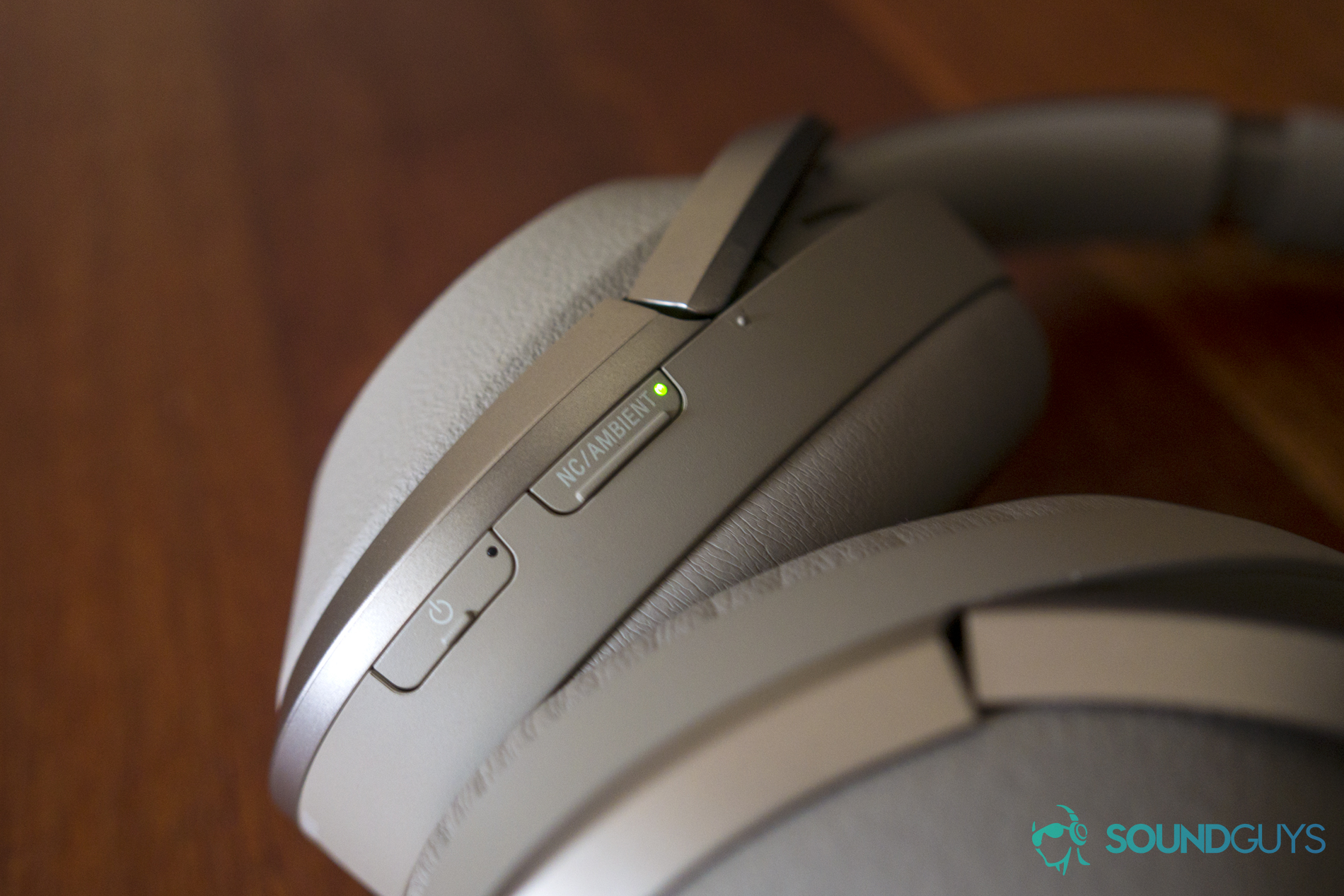 A photo of the Sony WH-1000MXM2's power and active noise canceling buttons on the left ear cup.