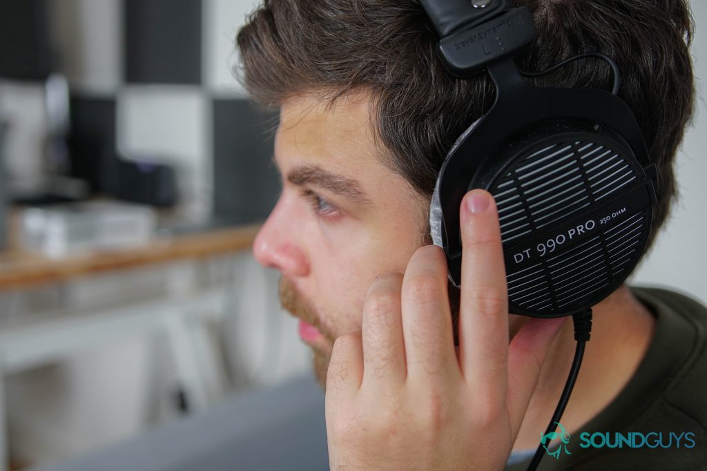 A photo of the Beyerdynamic DT 990 PRO being worn by writer Adam Molina.