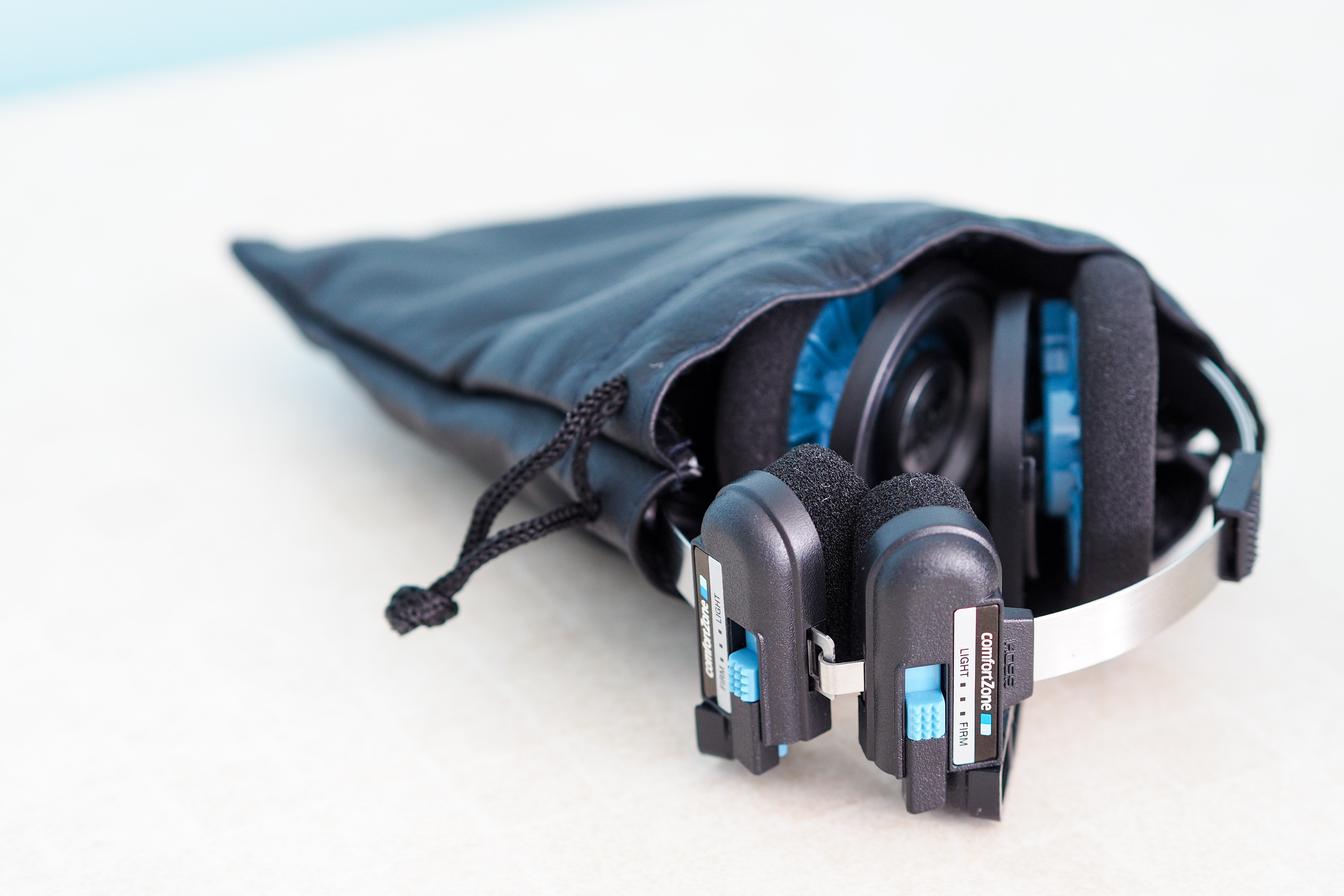 JLab Rewind Wireless Retro review: The Koss Porta Pro folded up and half out of the included drawsting bag.