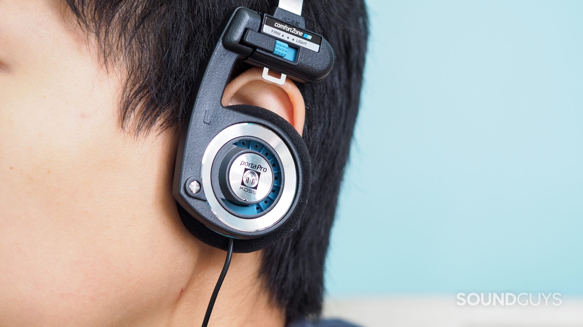 Koss_PortaPro_8_LK A woman wears the Koss Porta Pro semi-open headphones worn by a woman.