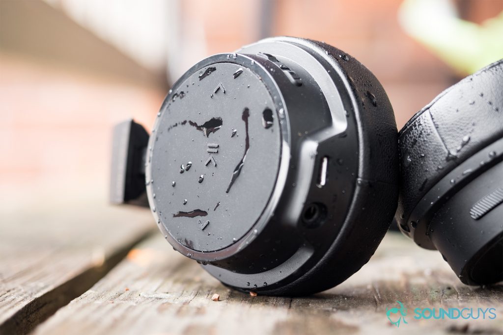 The rubberized controls are easy to understand and navigate. While running, pressing the buttons is a thoughtless action. Pictured: The Plantronics BackBeat 500 FIT left ear cup with water droplets.