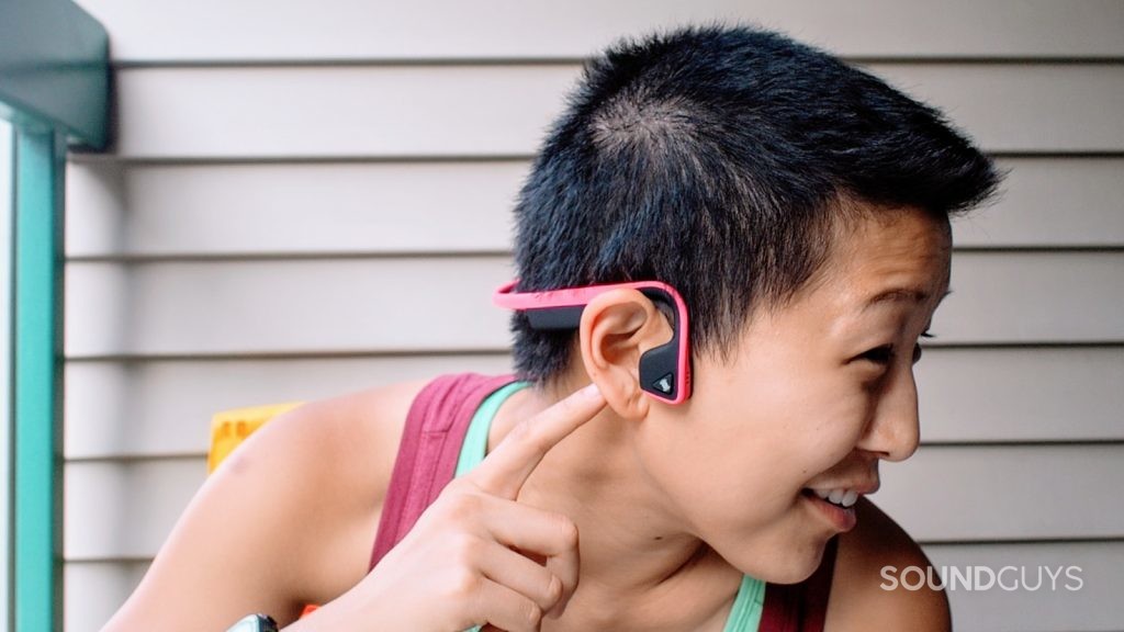 A picture of a woman wearing the Aftershokz Trekz Titaniuum being worn by Lily.