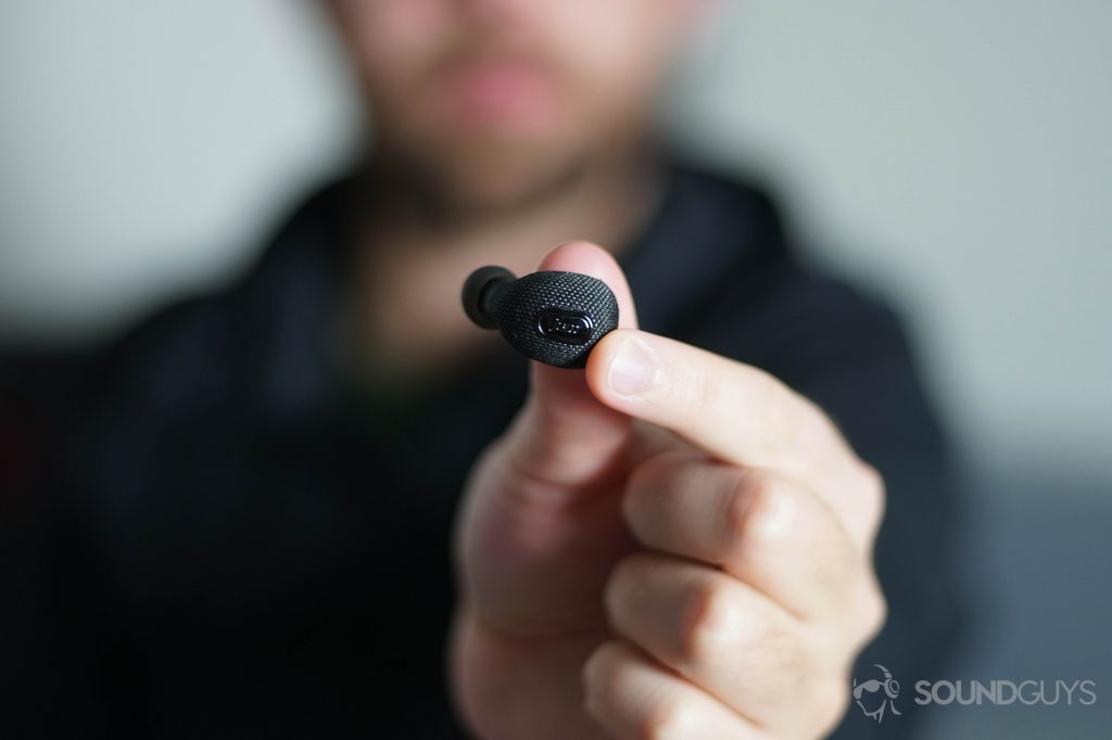 Adam holding the JAM Ultra True Wireless truly wireless earbuds