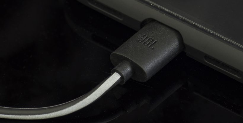 JBL Reflect Aware close-up of connector.