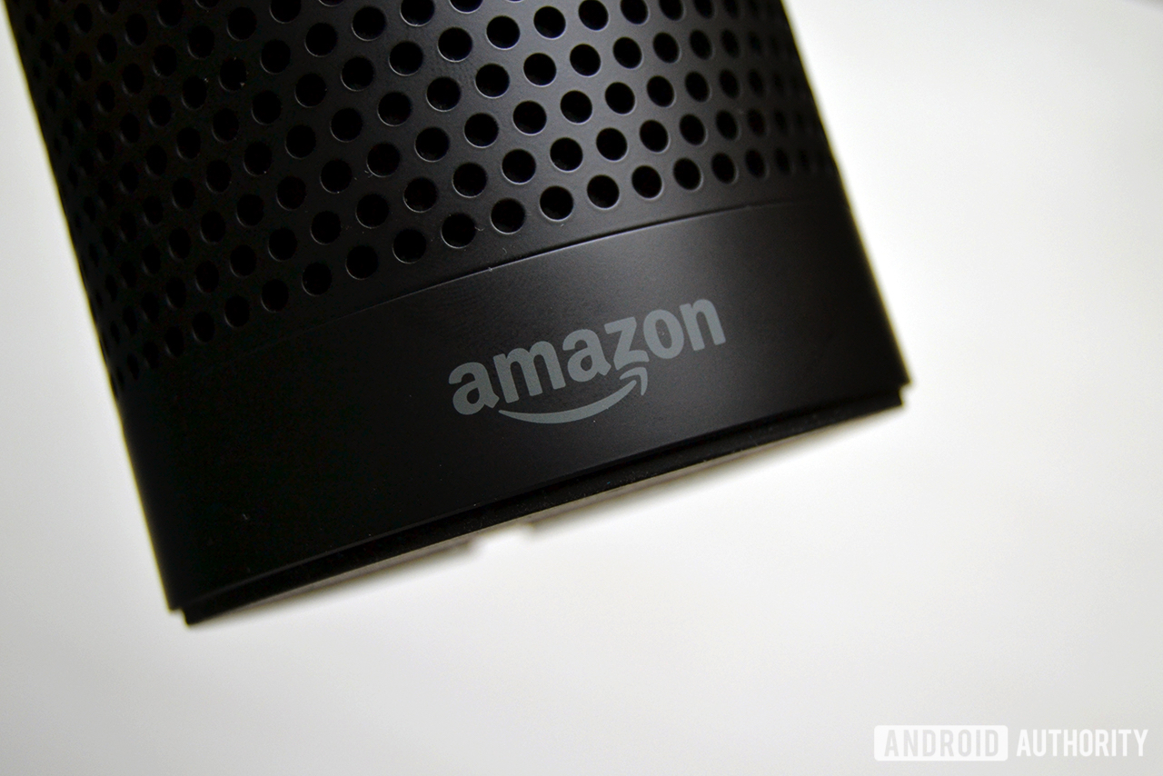 A picture of an Amazon Echo in black on a white background.