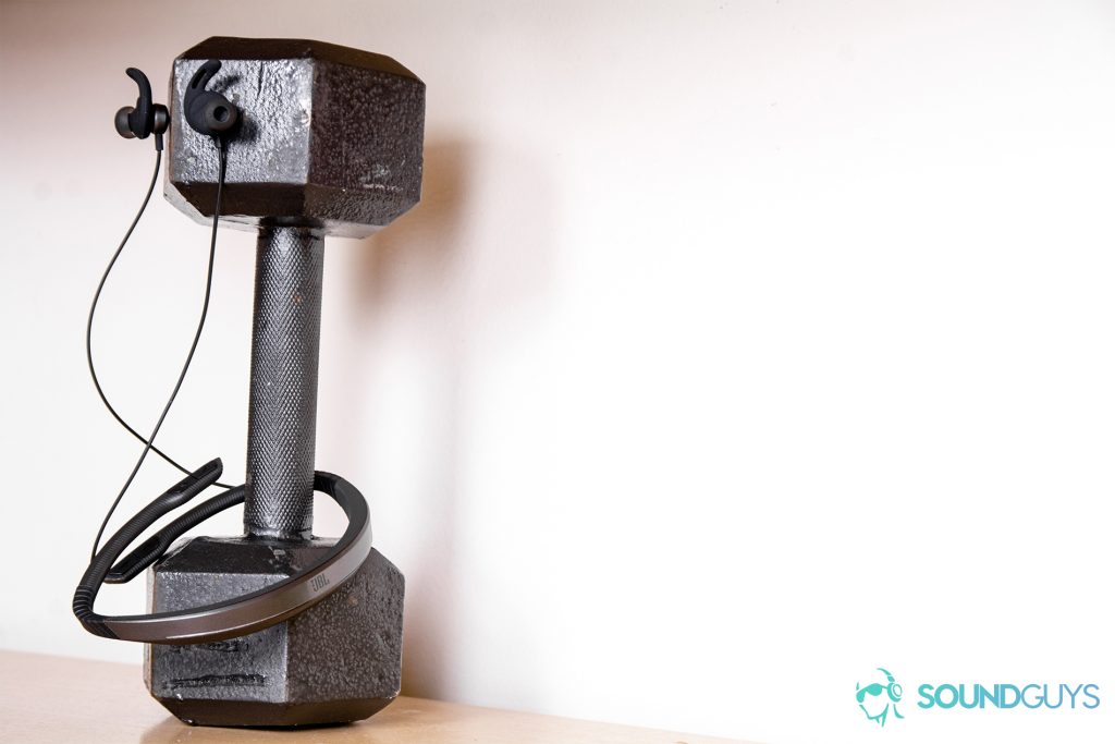 Under Armour Sport Flex Wireless by JBL - earbuds magnetic housings attached to a 10lb weight with the neckband flexing around the bottom.