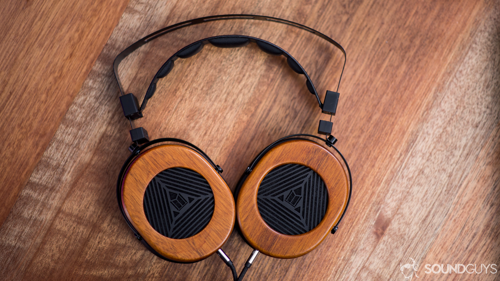 A photo of the Monoprice Monolith M565 on a mahogany desk.