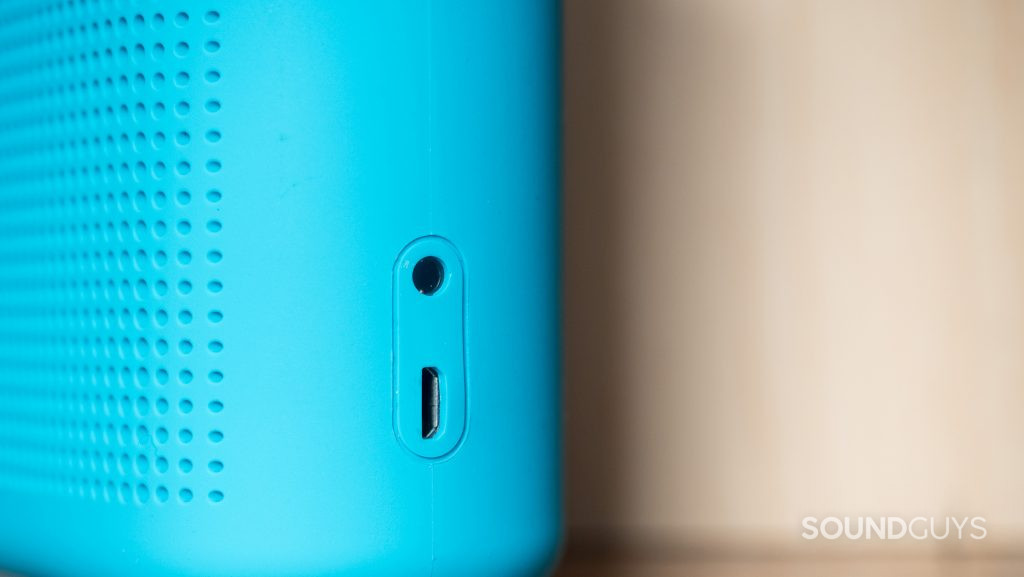 The Bose SoundLink Color II microUSB charging input is located below the 3.5mm auxilliary input.