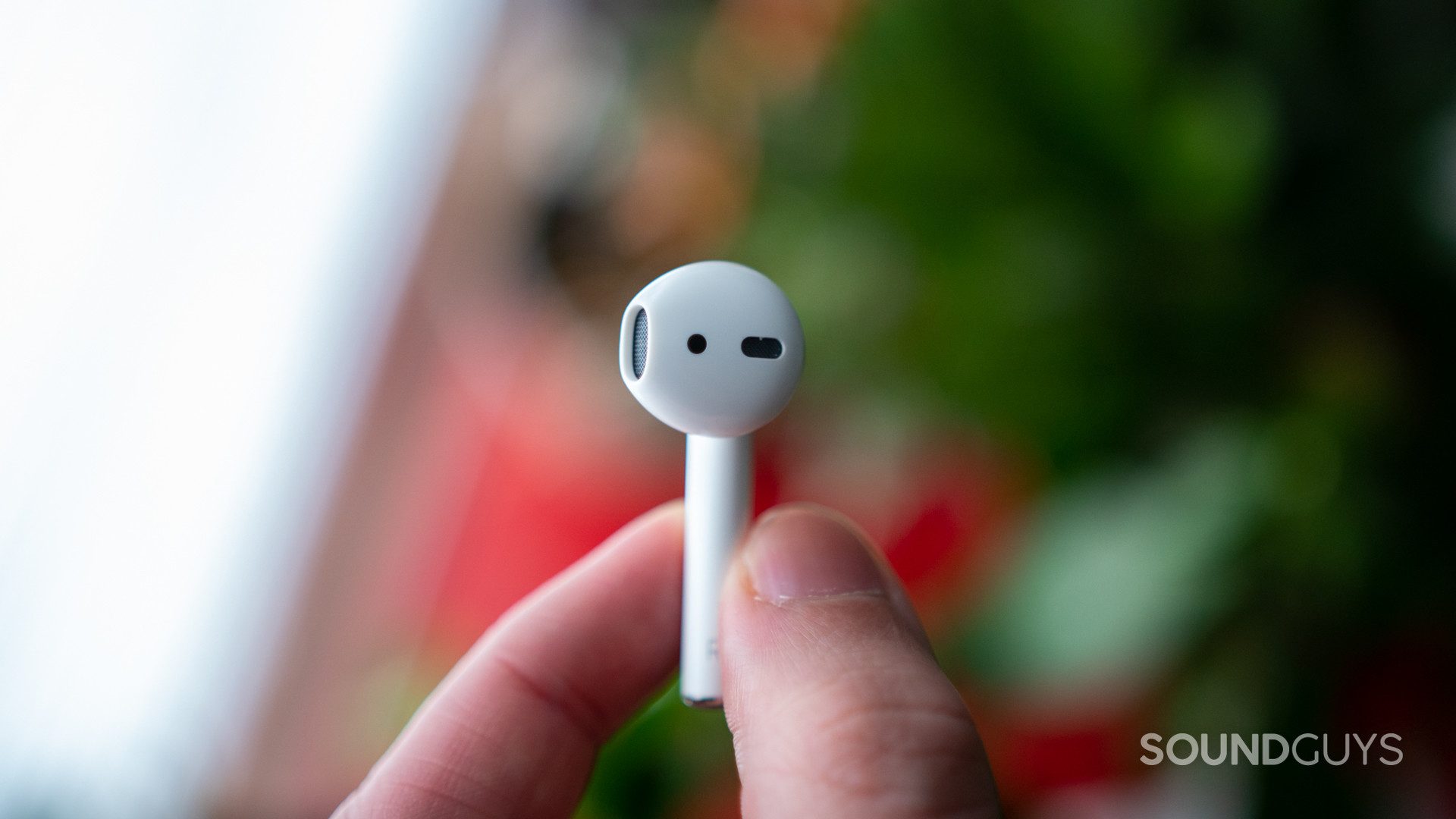 A single earphone of the Apple AirPods (2nd generation).