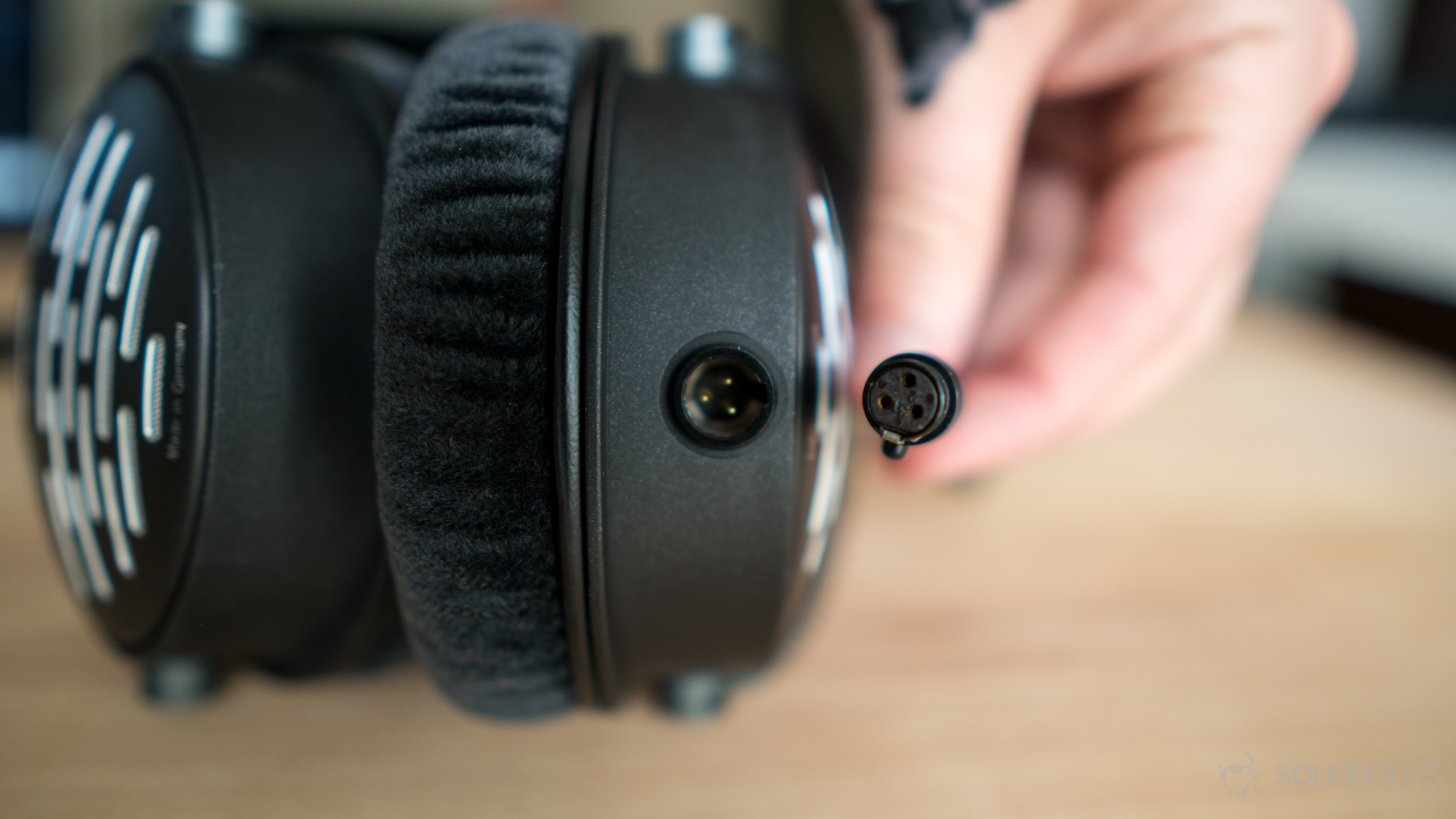 The 3-pin mini XLR cable plug into the left ear cup.