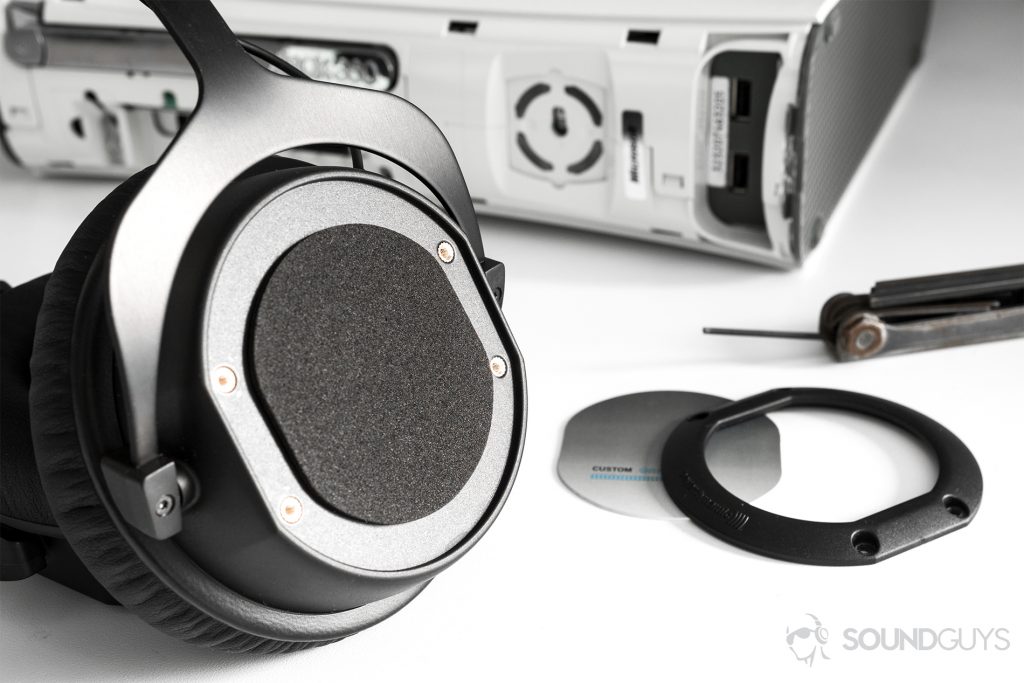 Beyerdynamic CUSTOM Game: The headphones are angled off to the side, unsheathed to replace the ear cup plates.