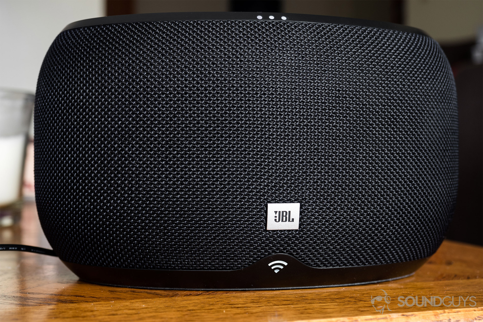 JBL_Link 300_LK_3 JBL Link 300 Google Assistant-integrated smart speaker: A straight-on shot of the speaker in black. The top three (of four) LEDs are lit up as well as the bottom WiFi LED.