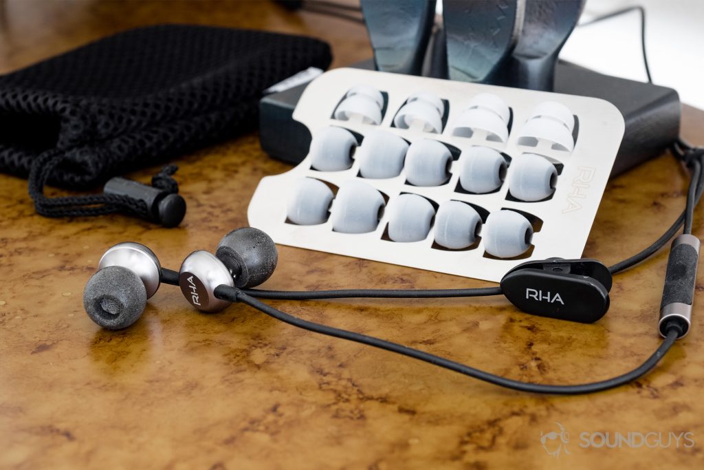 Finding the best ear tips: The aluminum carrier holds eight pairs of ear tips, two of which are double-flanged for increased passive noise isolation. Pictured: The aluminum carrier filled with ear tip options, the mesh carrying pouch, a shirt clip, and the earbuds.