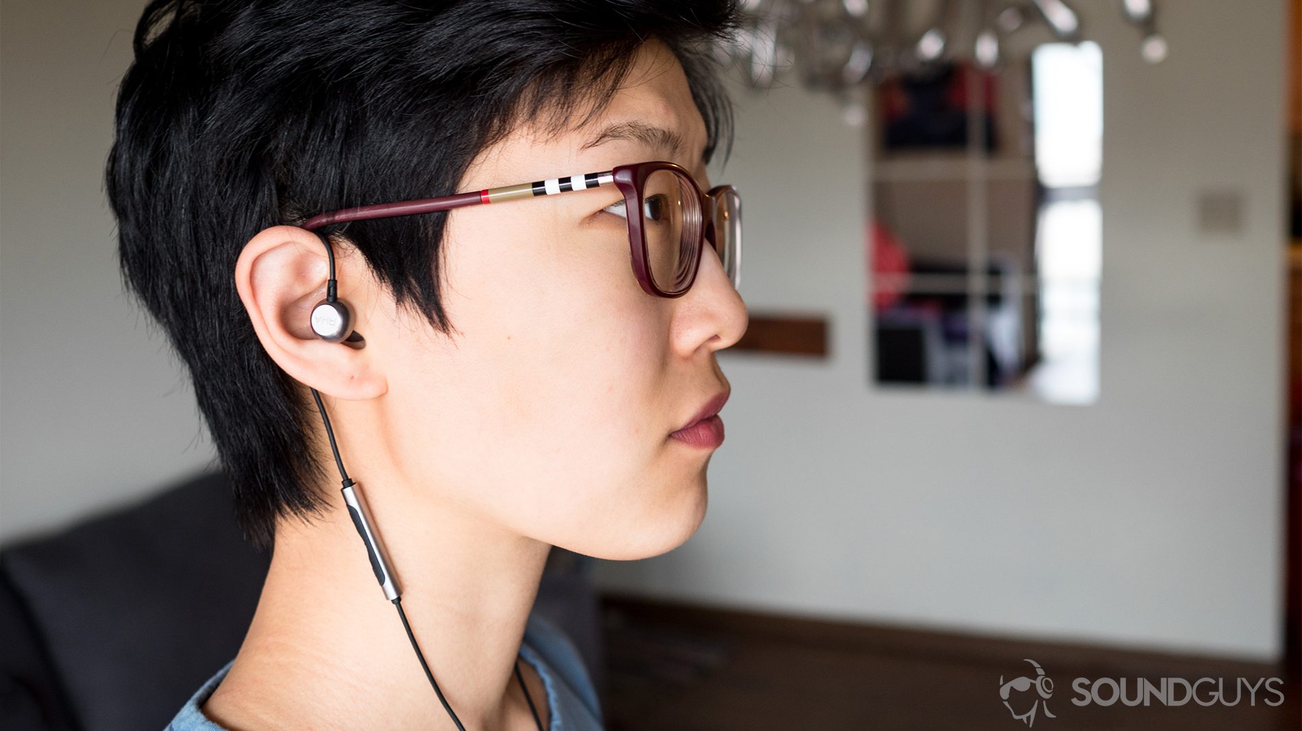 To reduce microphonics, wear the RHA MA650 around the ear. Pictured: The earbuds wrapped around the ear like a hook to reduce reverberations from echoing up the cable and into the ear canal.