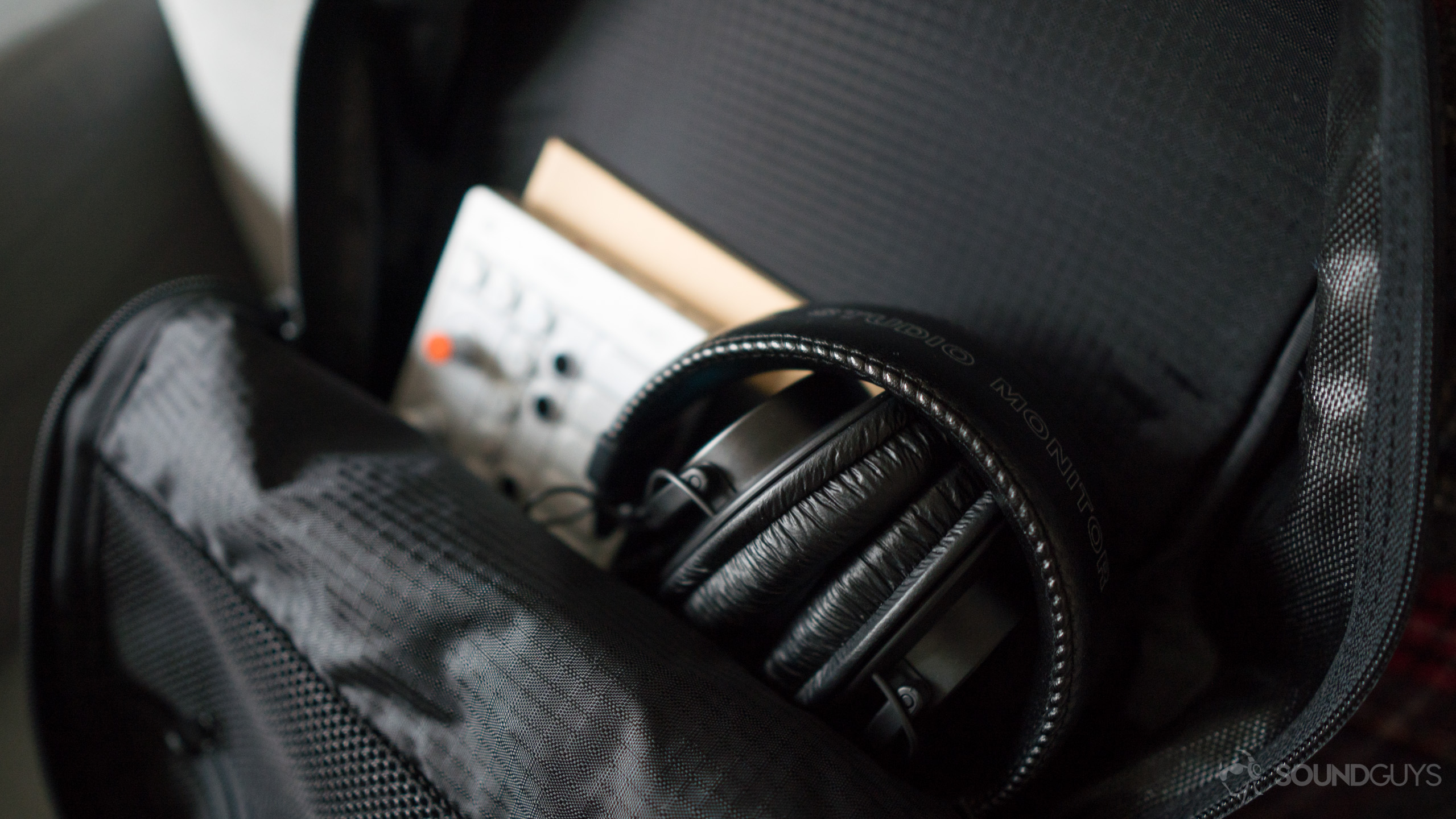 The Sony MDR 7506 headphones in a bag.