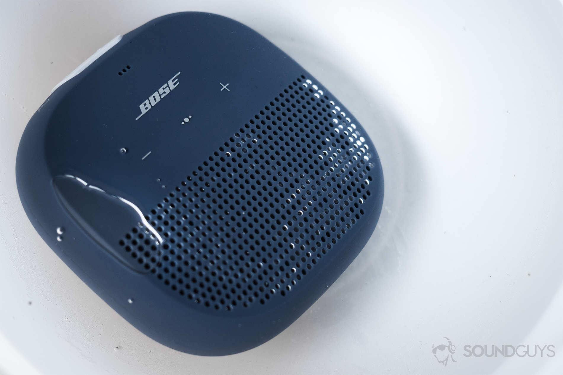The Bose SoundLink Micro (blue) underwater (white background)