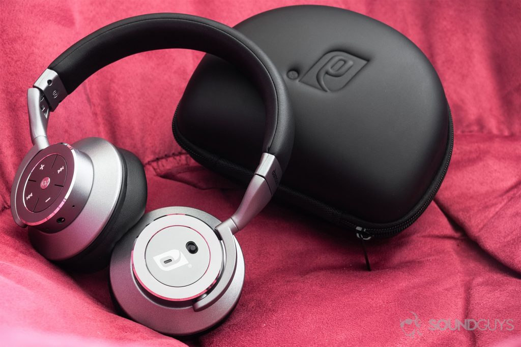 Damson HeadSpace Active Noise-Cancelling review: The headphones in front of the D-shaped hard-shell carrying case.