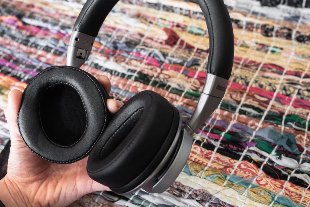 Damson HeadSpace Active Noise-Cancelling review: The headphones tilted in the hand to illustrate the size of the ear cups.