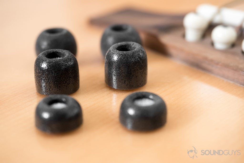Finding the right ear tips: Comply memory foam ear tips on a guitar.