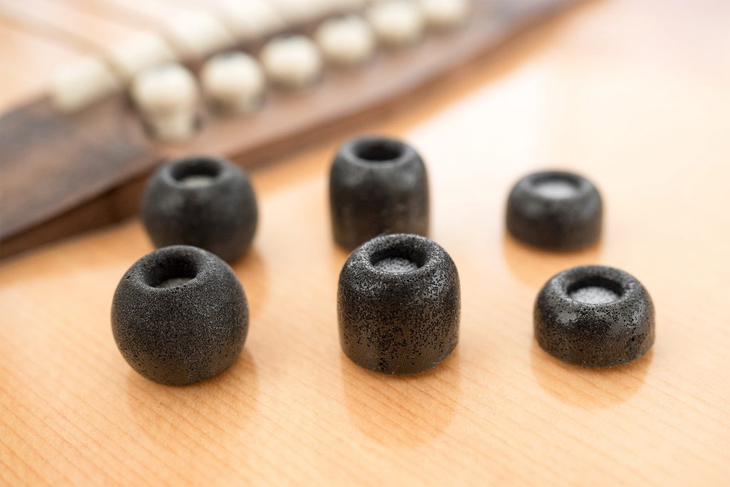 Best earbuds: Comply memory foam ear tips on a guitar.