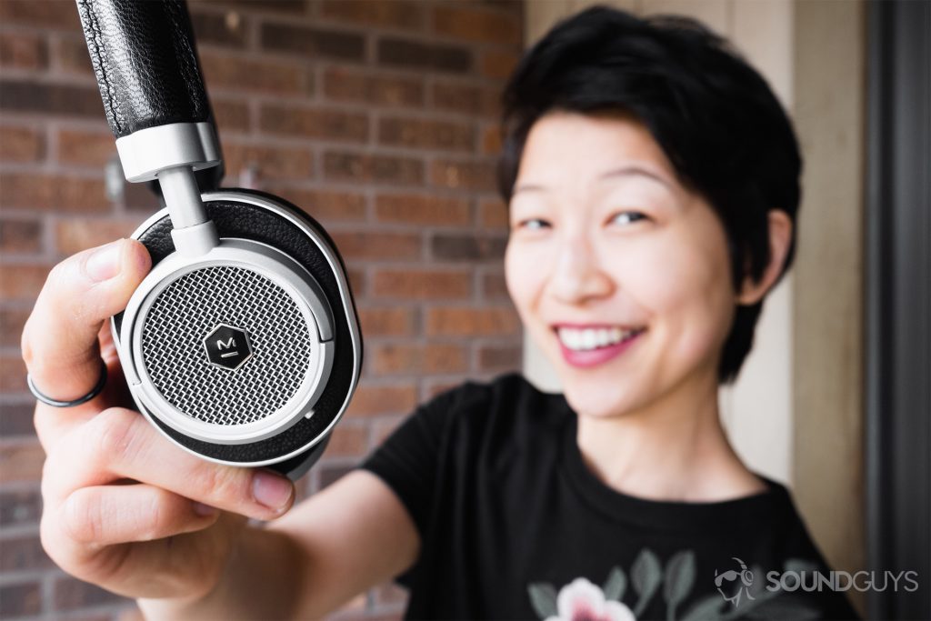 Master & Dynamic MW50 review: The headphones held by Lily.