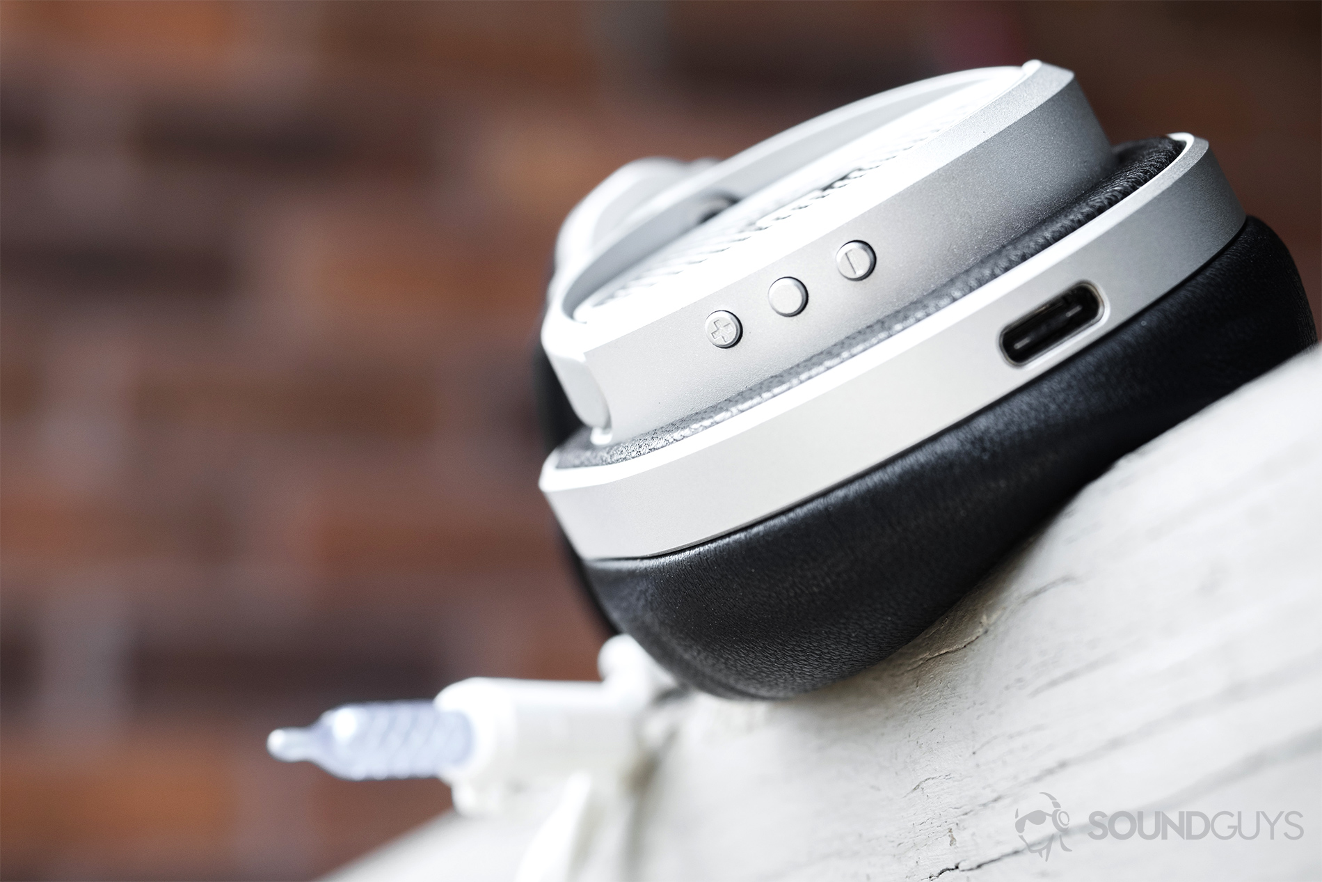 Master &amp; Dynamic MW50 Wireless review: A close-up of the playback controls and USB-C port.