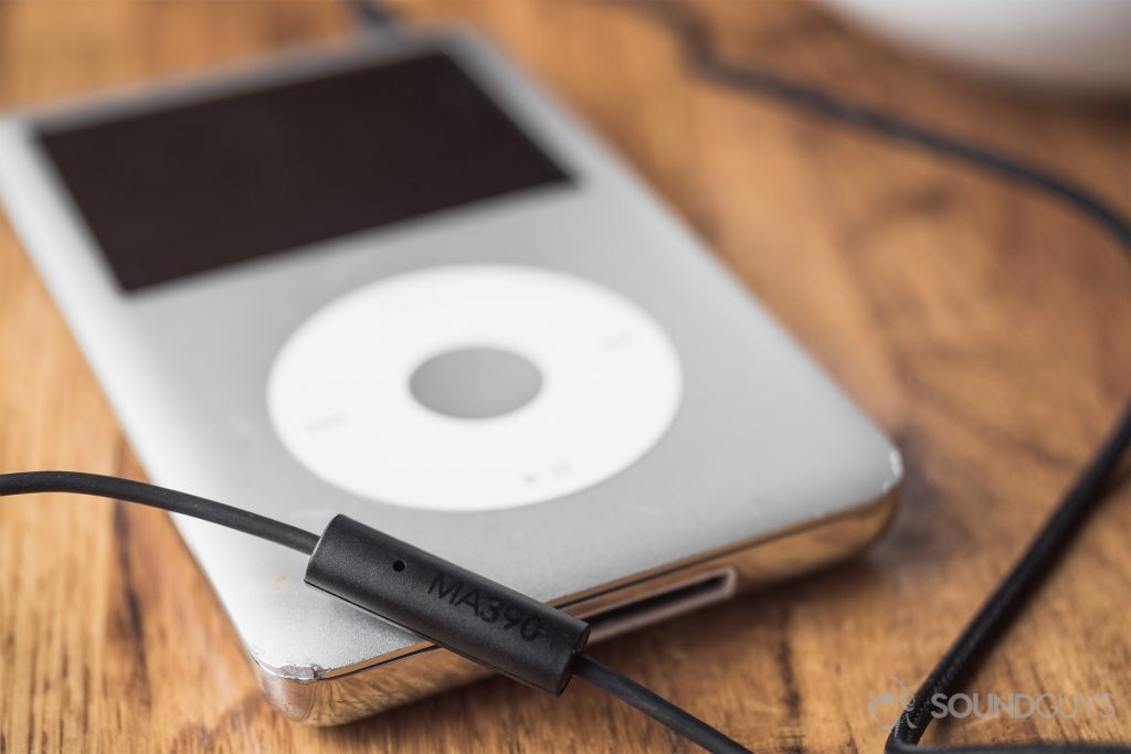 RHA MA390 review: A close-up of the RHA one-button microphone placed atop a silver iPod classic.