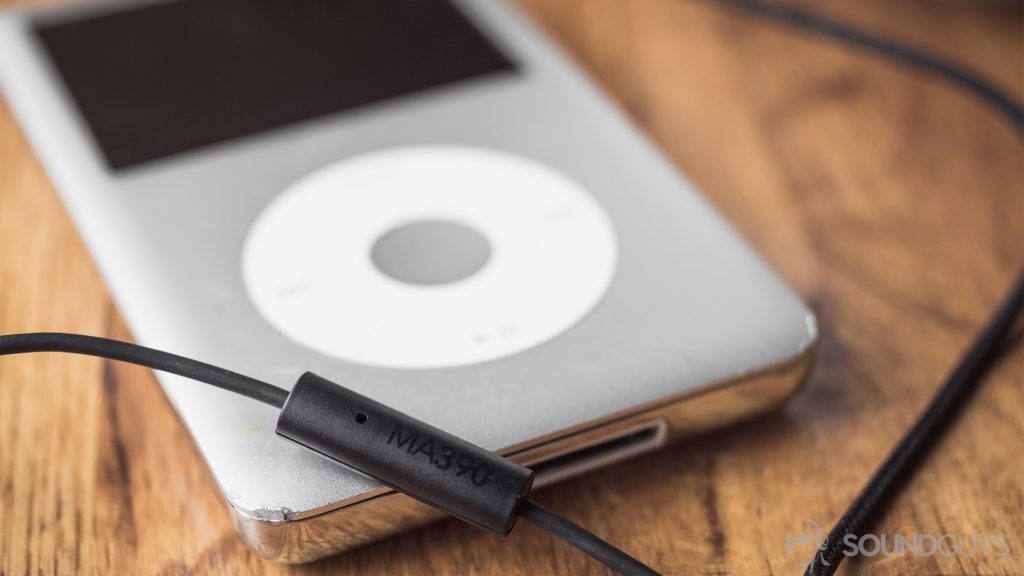 RHA MA390 review: A close-up of the RHA one-button microphone placed atop a silver iPod classic.