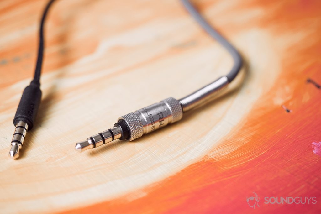 RHA MA390 review: The MA390 headphone jack on the left (all black) next to the MA750i headphone jack, which is stainless steel with a spring stress-reliever.