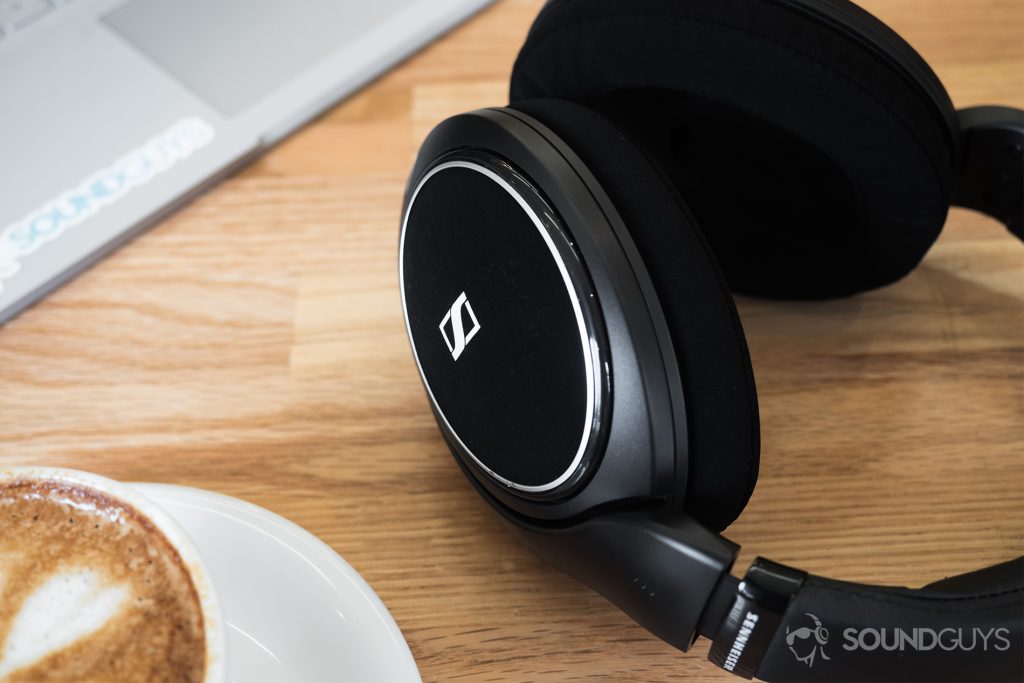 Sennheiser HD 598 CS review: A cappuccino in the bottom-left corner of the image, the trackpad portion of a Microsoft Surface Book in the top-left corner, and the headphones taking up the right section of the image.