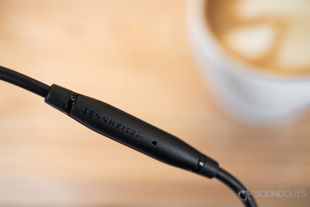 Sennheiser HD 598 CS review: A close-up of the in-line mic with a blurred out cappuccino in the background.