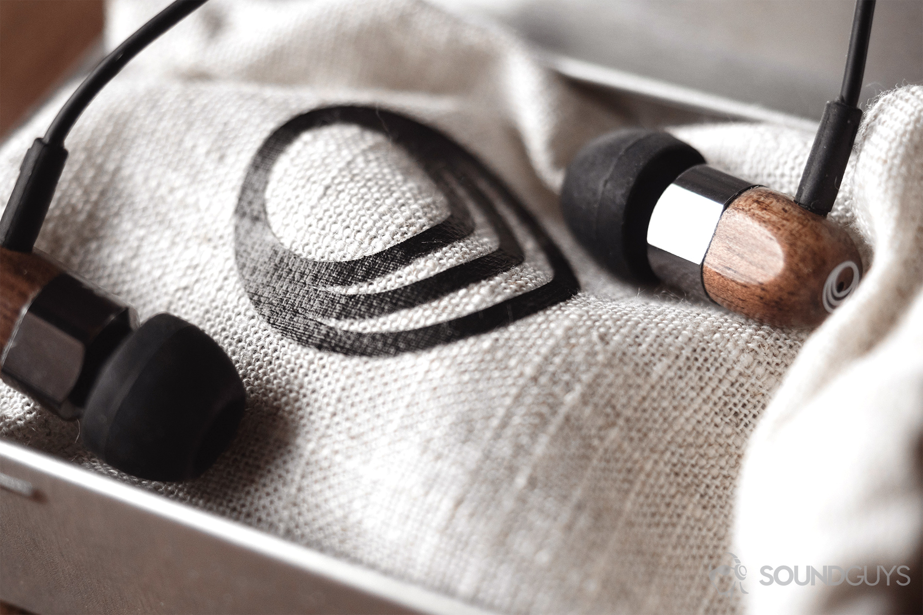 Thinksound ts03+mic review: A close-up of the earbuds on the cotton pouch that's in the included tin.