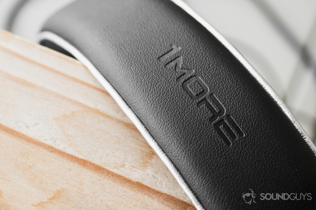 1More Triple-Driver Over-Ear review: A close-up of the headband to display the embossed 1More logo on the leather headband.